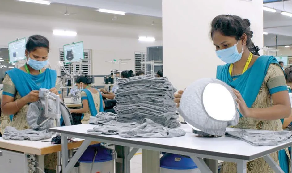 Quality-control team inspecting finished garments