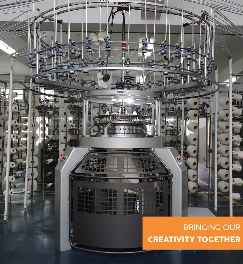 Circular knitting machinery inside the ACCRO PARIS manufacturing facility