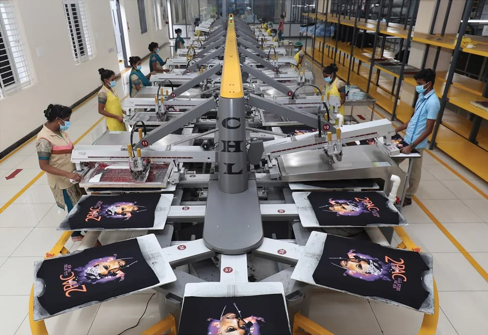 Automated oval garment printing line in operation