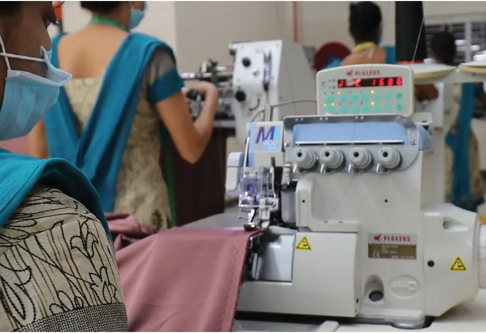 Skilled sewing operator using an industrial overlock machine